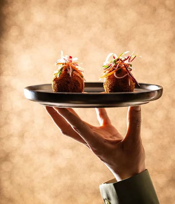 bhajis, held aloft